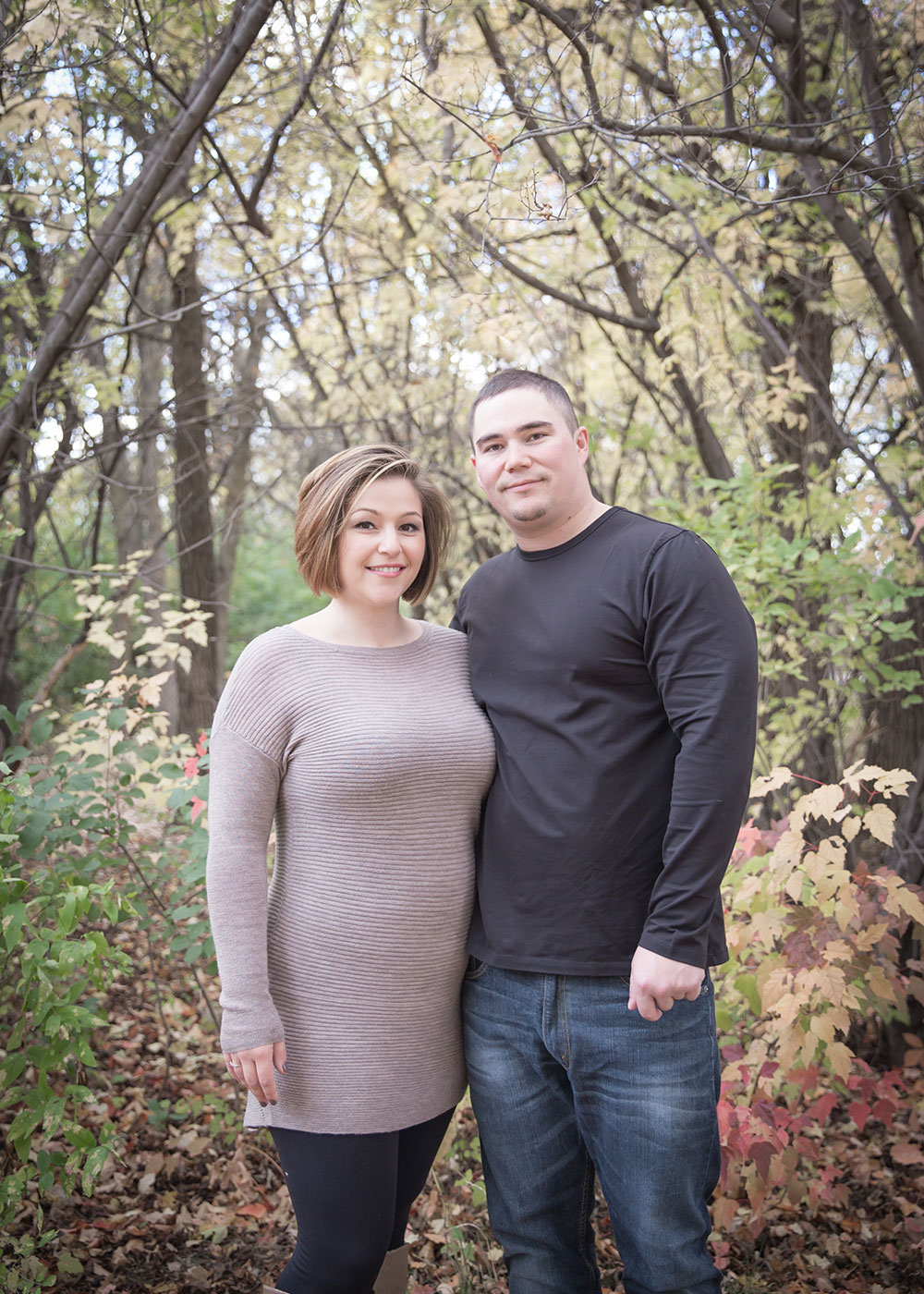 a photo of a young couple outside in the fall time