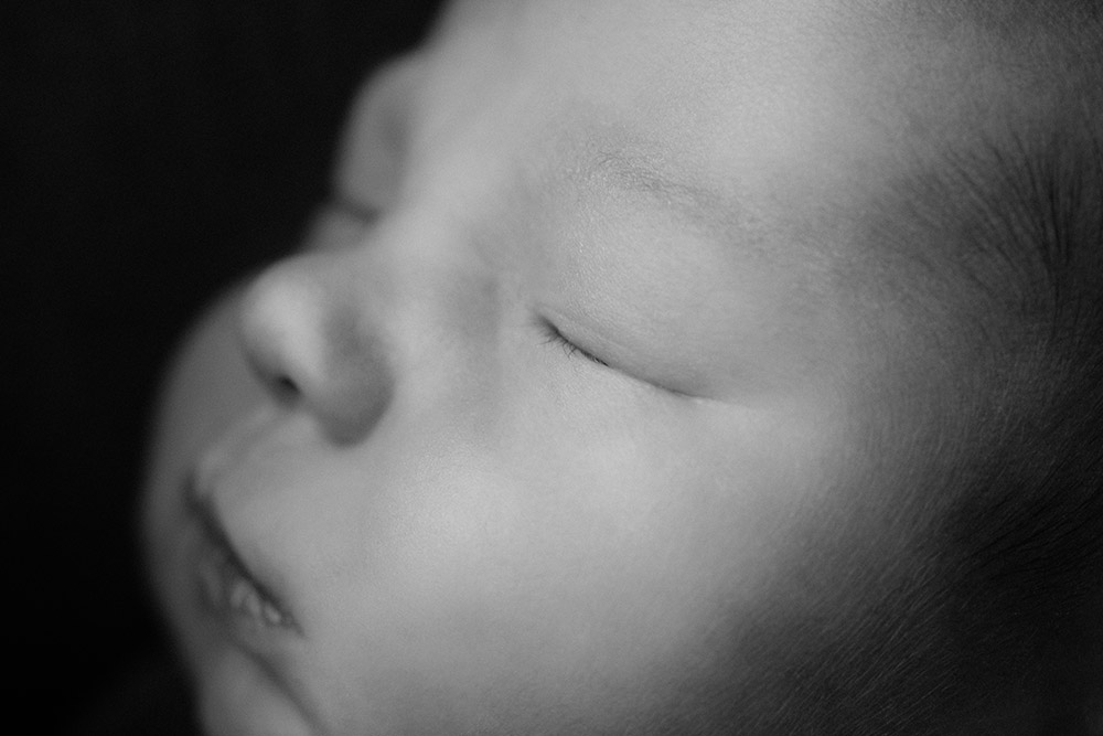 a macro shot of a newborn baby boy