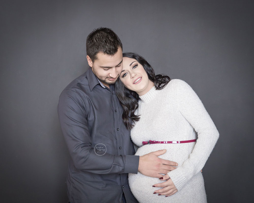 a maternity photo of an expecting couple