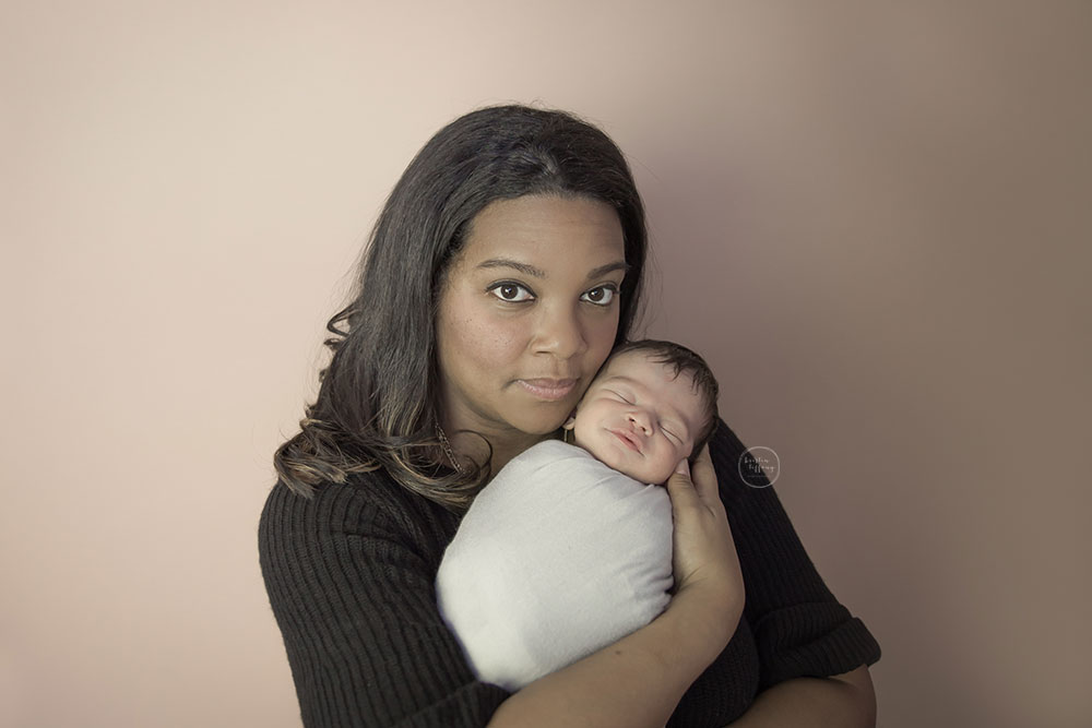 a photo of a new mother with her newborn son