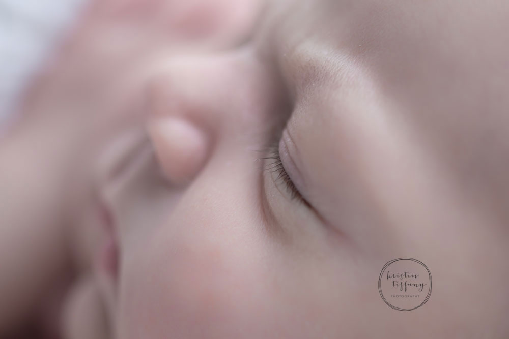 a macro shot of a newborn baby's face