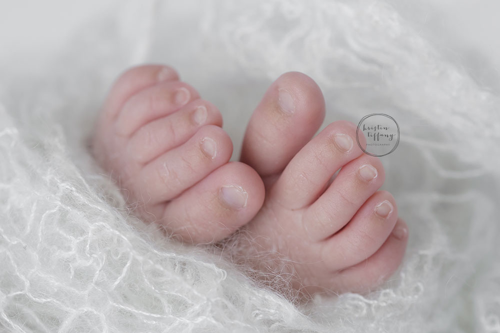 a photo of a newborn baby girl's feet