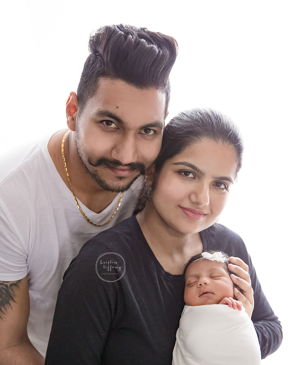 a family photo with a newborn baby