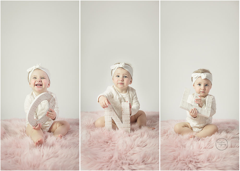 a photo collage of a baby holding the letters o-n-e