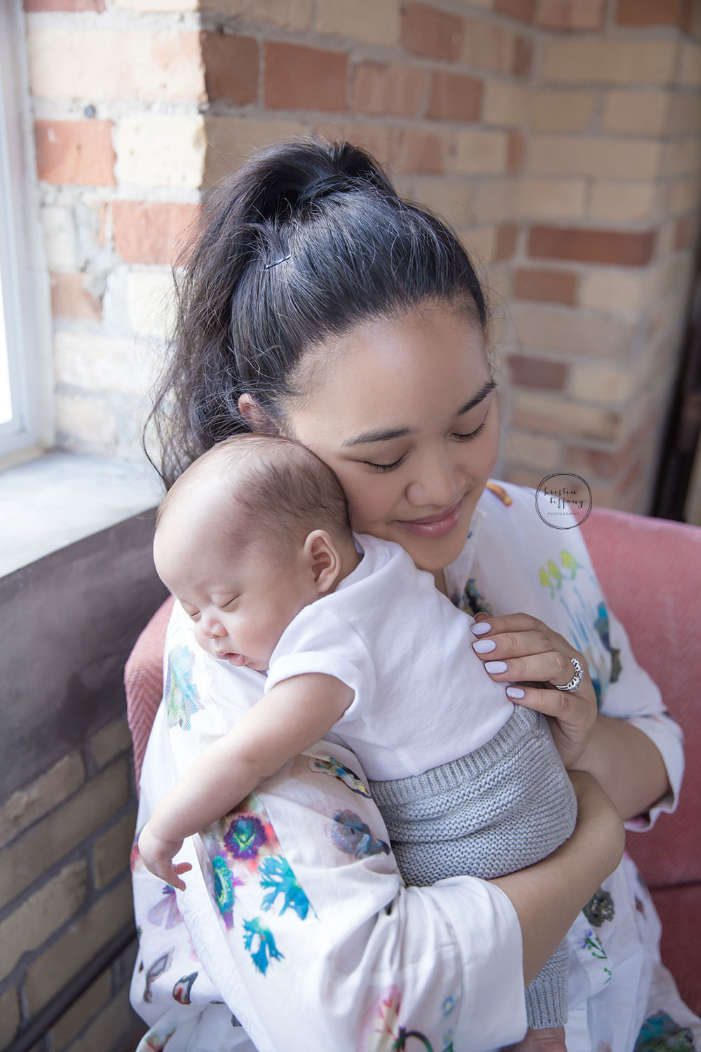 a photo of a new mommy holding her baby son