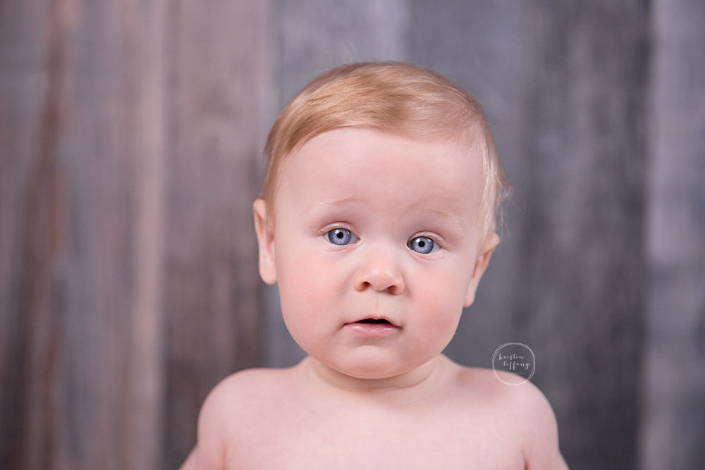 a photo of a baby boy with big blue eyes