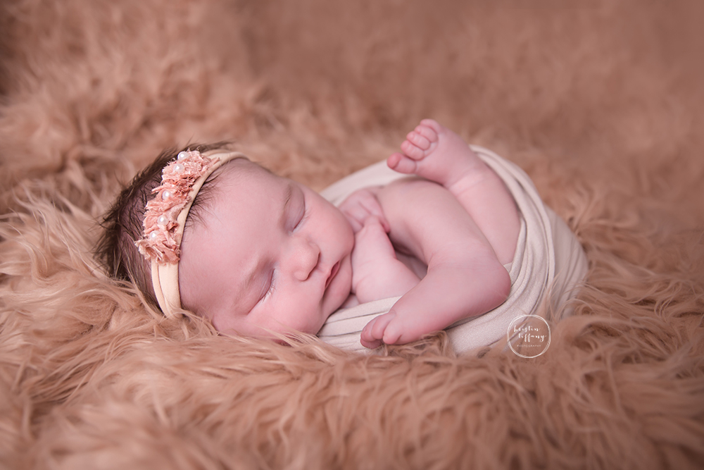 a newborn photo of a baby girl