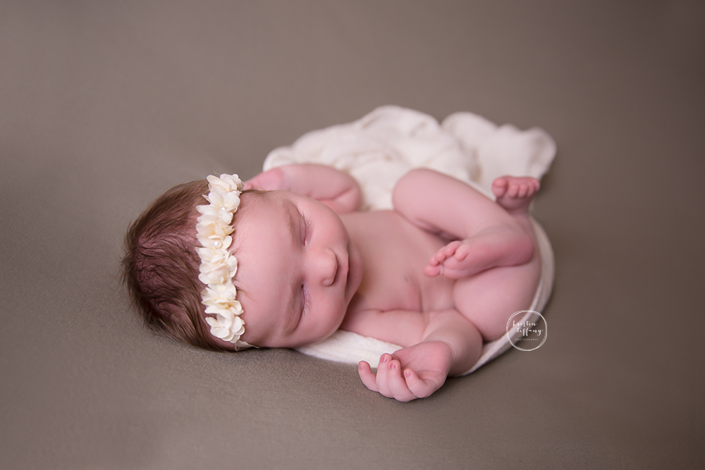 a photo of a sleeping newborn girl