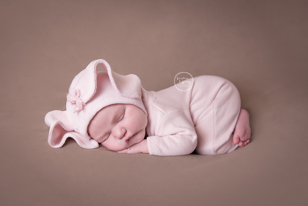 a photo of a newborn baby in a bunny outfit