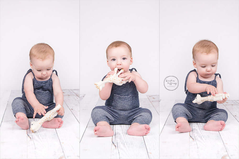 a photo of a baby boy chewing sofie the giraffe