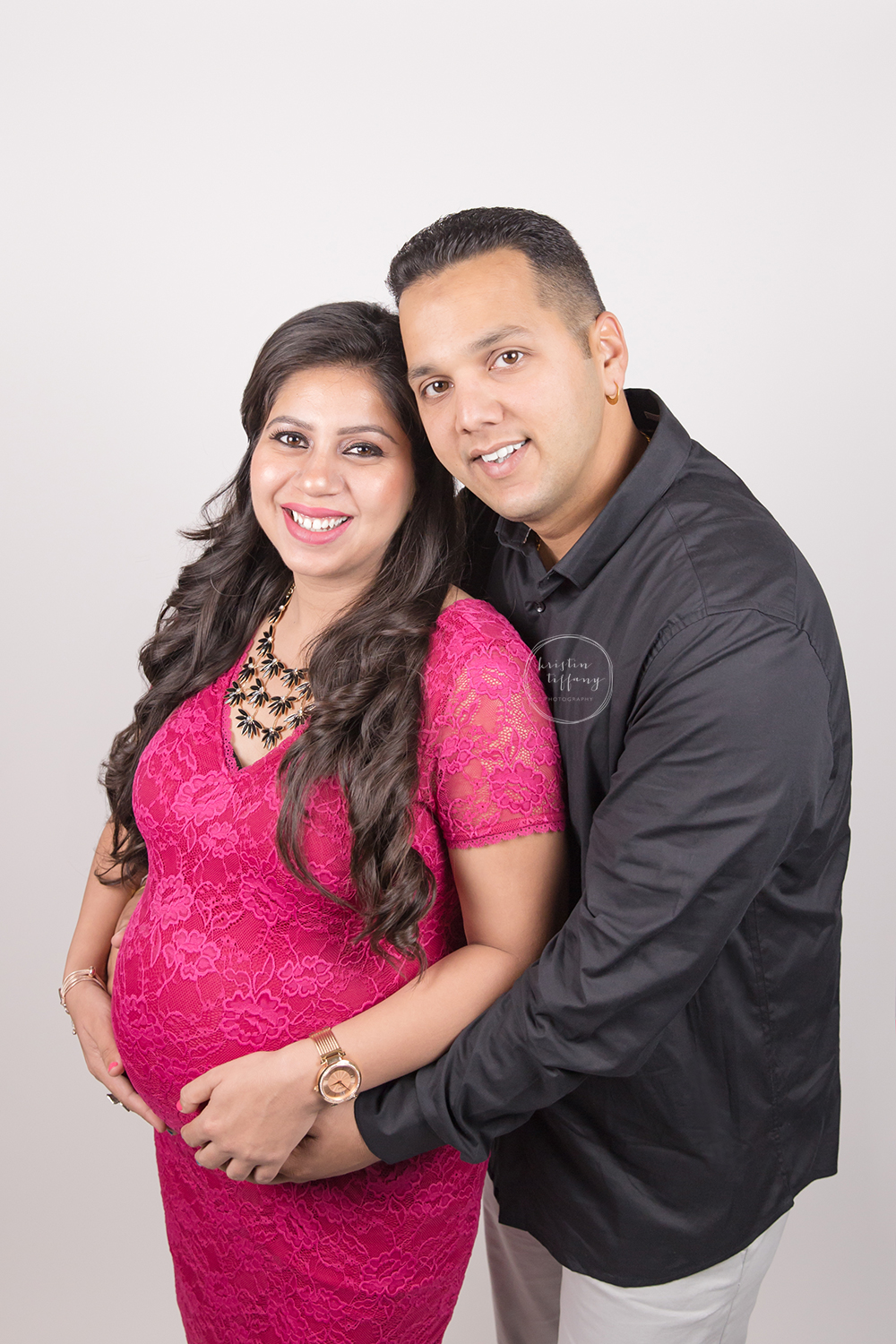 a photo of a couple expecting their first baby
