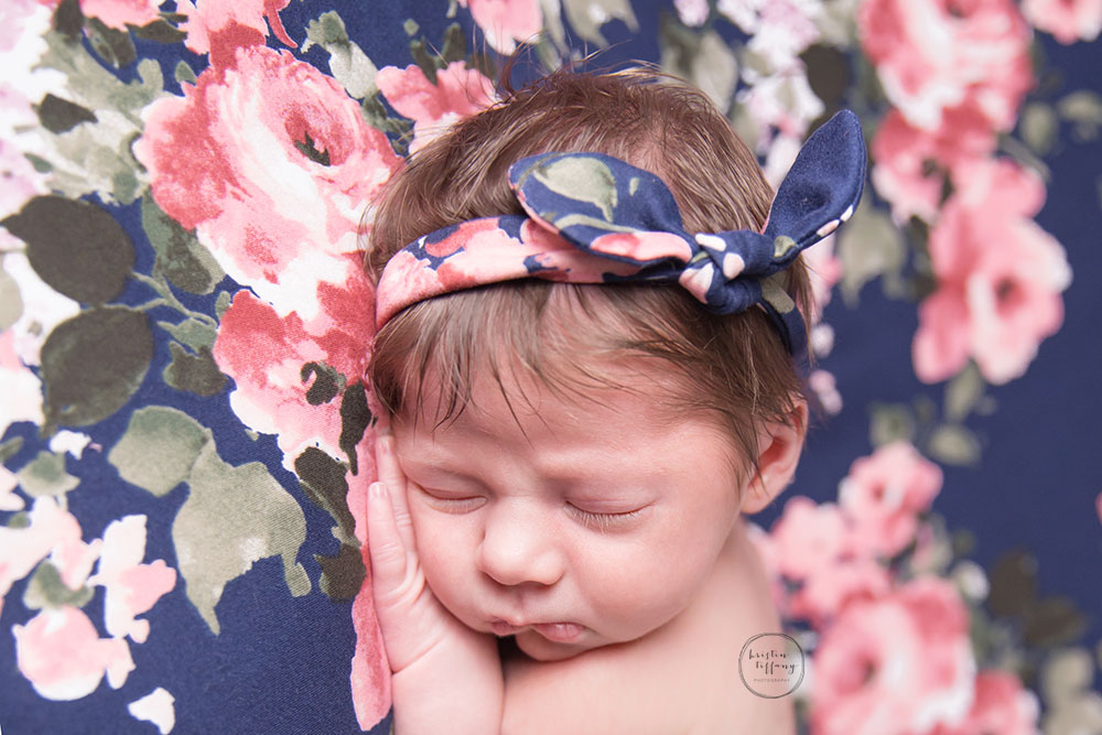 a photo of a sleeping newborn baby girl