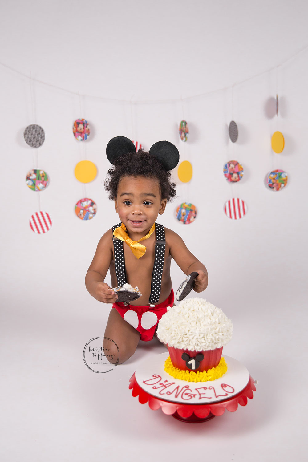 a photo from a Mickey Mouse themed cake smash