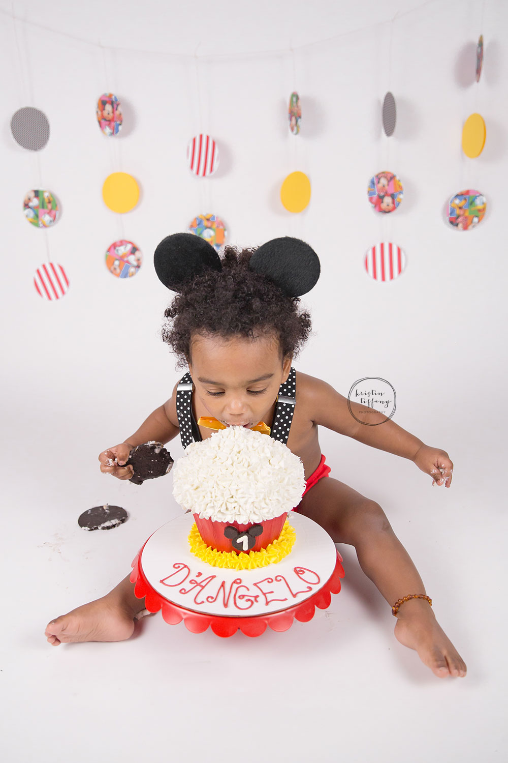 a photo from a Mickey Mouse themed cake smash