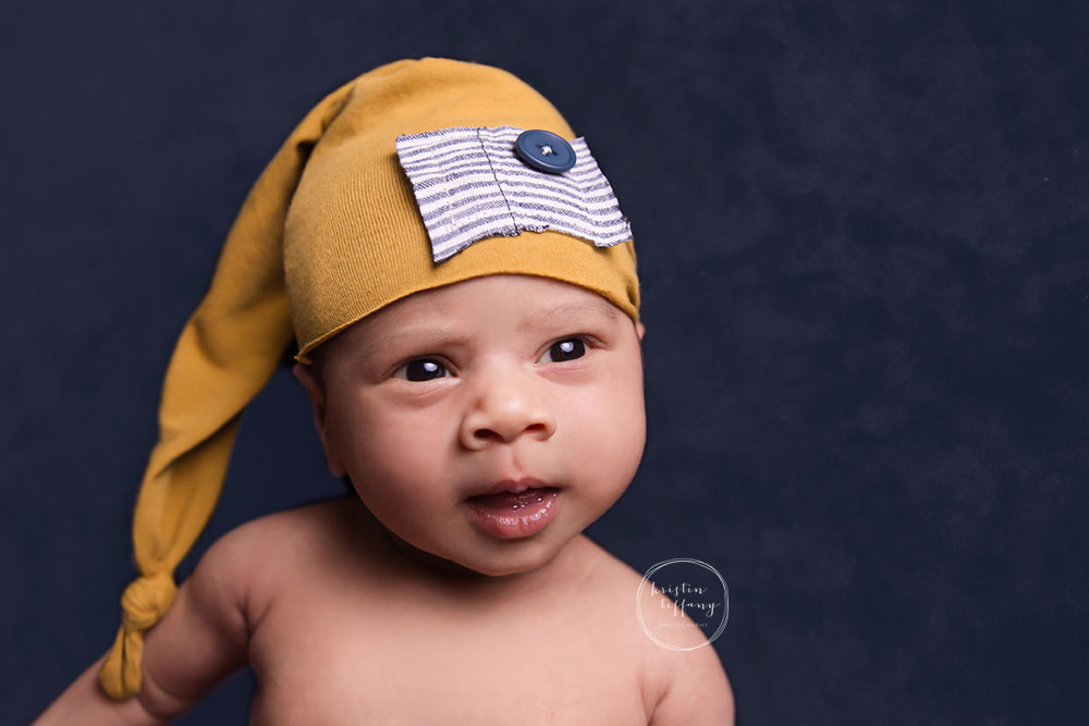 a photo of a baby boy in a sleepy cap