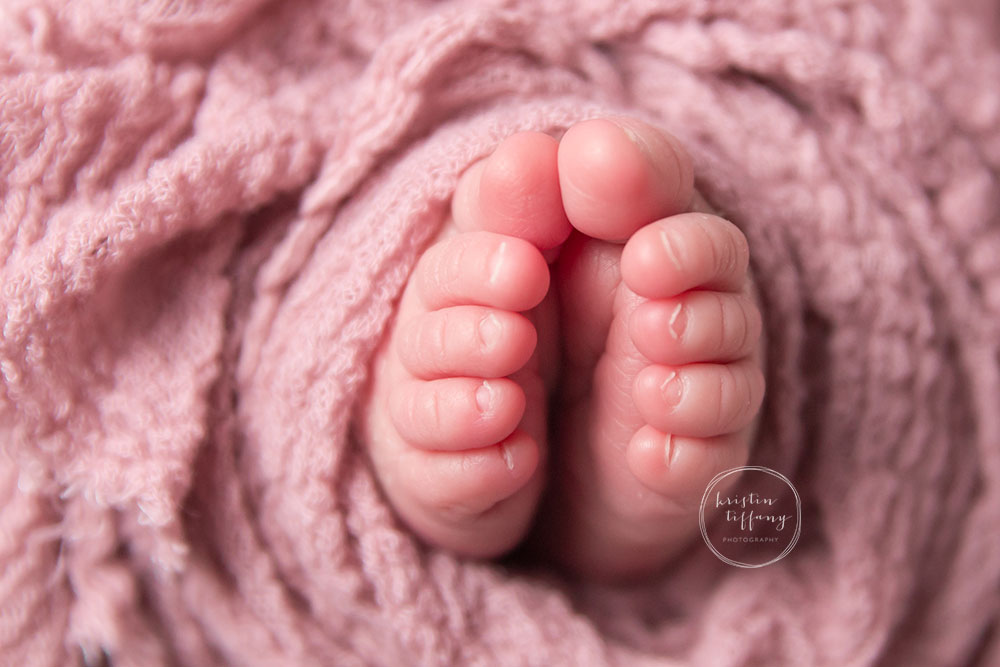 a photo of baby newborn toes