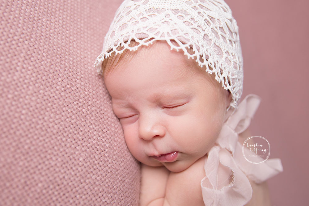 a photo of a baby girl at a newborn session