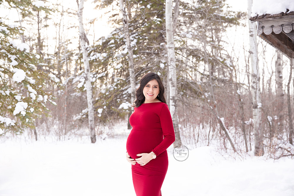 a maternity photo taken in the snow