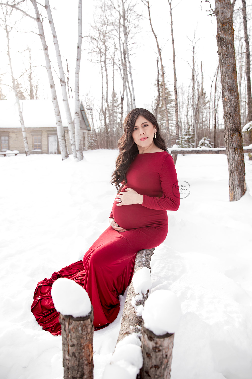 a maternity photo of a woman in the snow