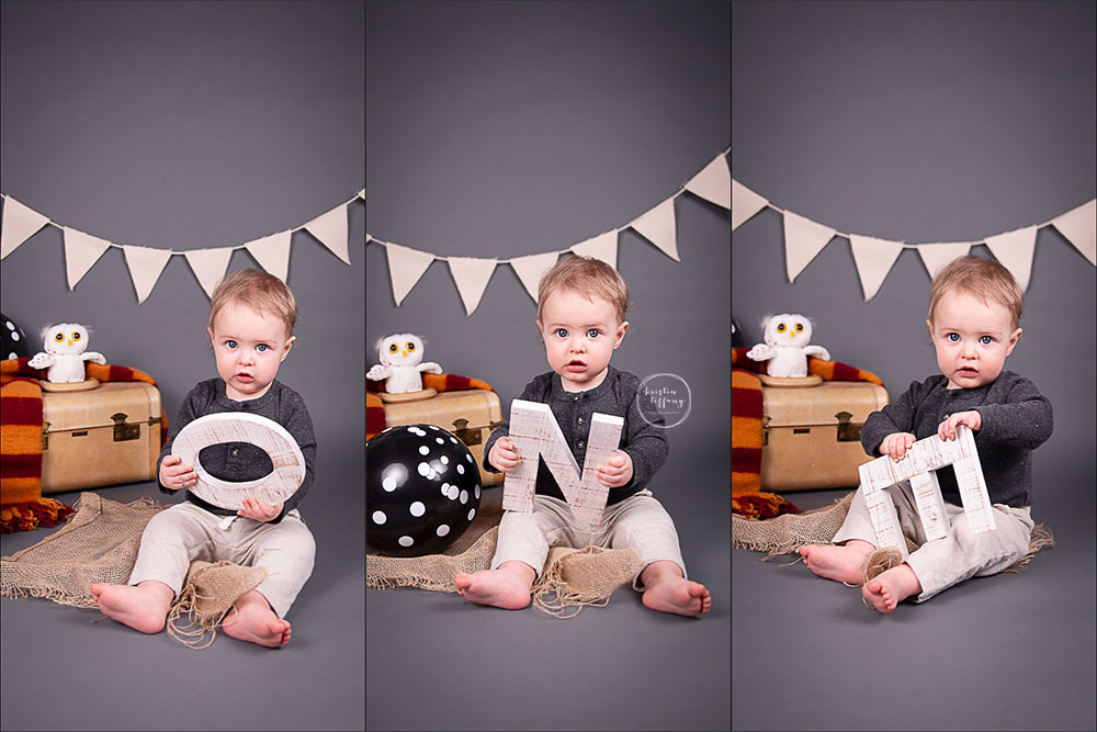 a photo of a baby boy at his Harry Potter cake smash photo session