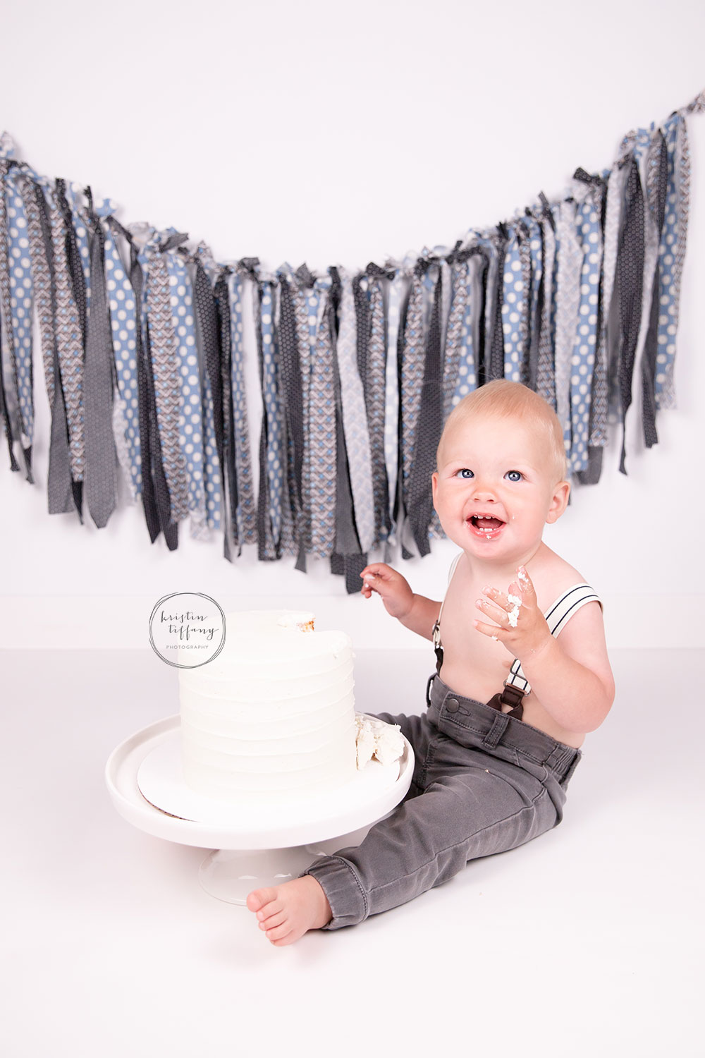 a photo of a baby boy at his cake smash photoshoot