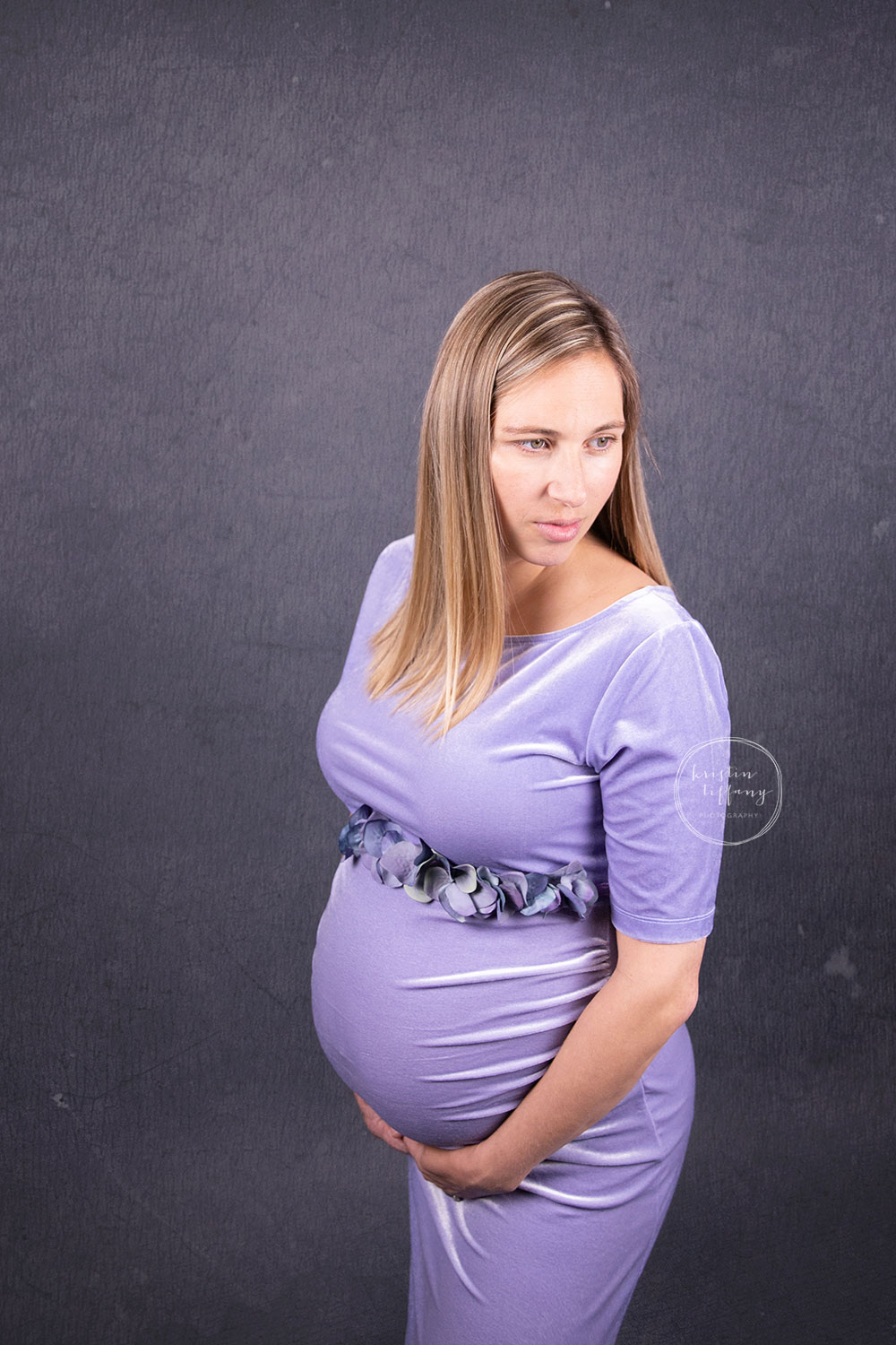 a maternity photo of a pregnant woman at her photo shoot