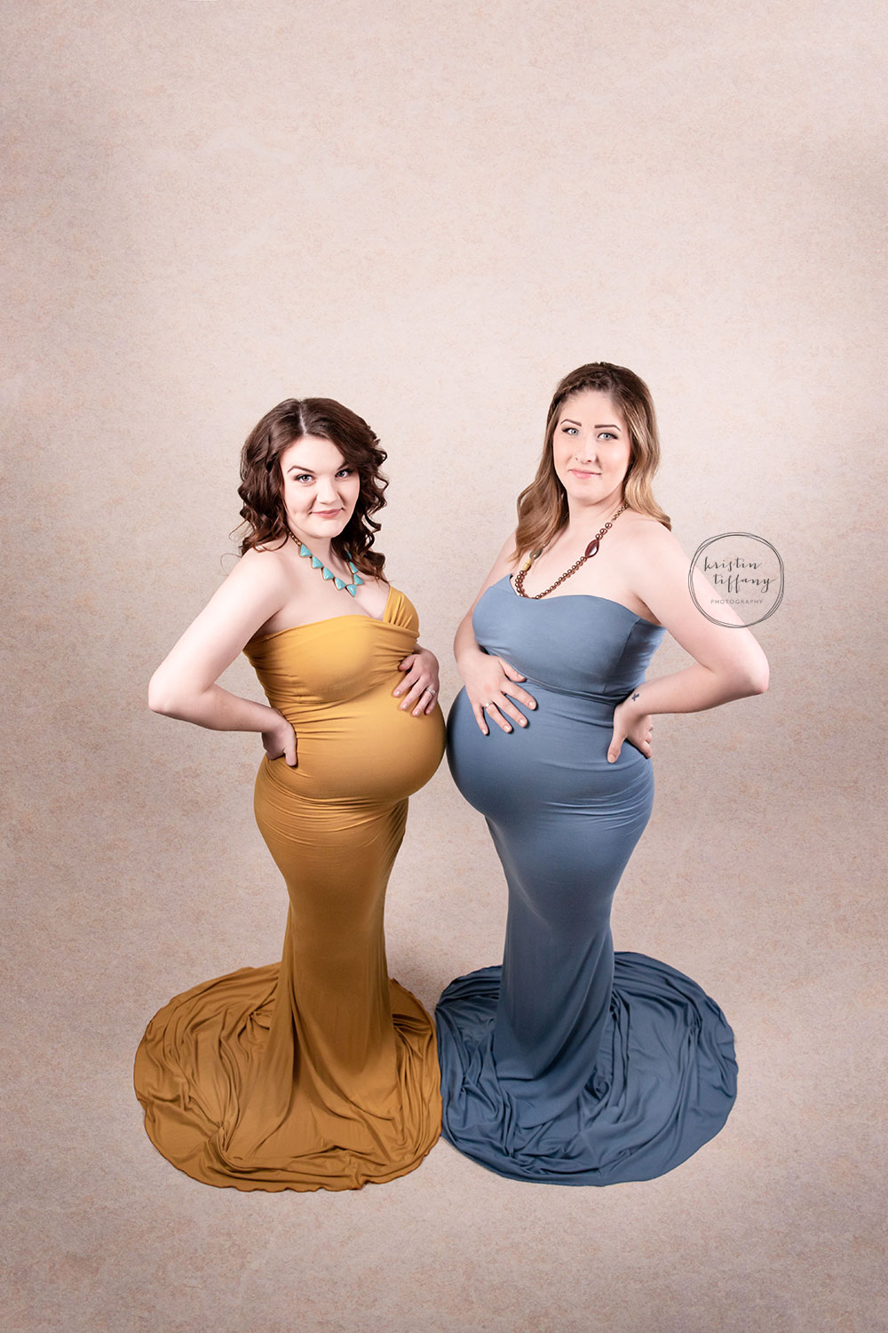 a photo of two pregnant women at a maternity photoshoot