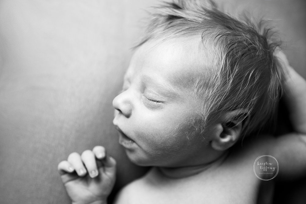 a photo of baby boy at his newborn photo session