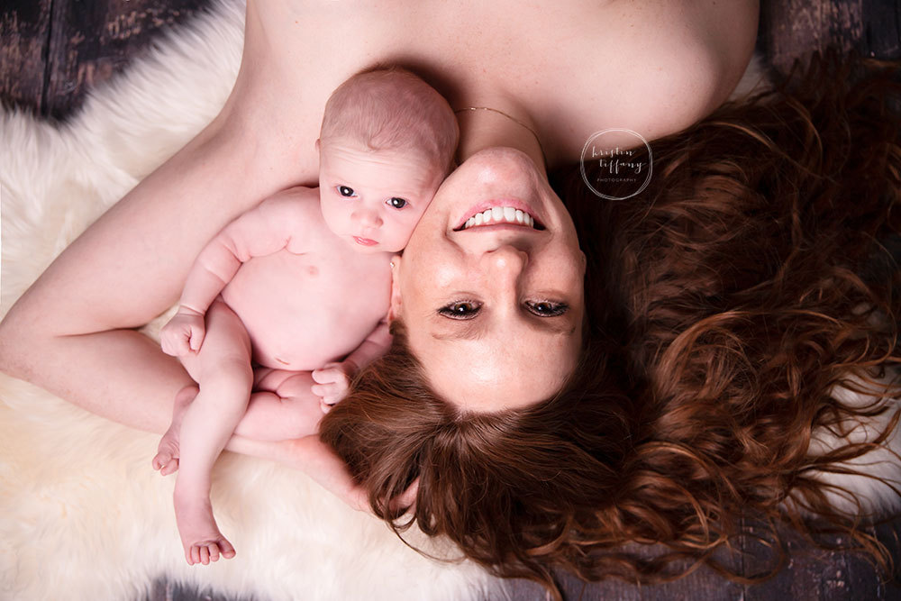 a photo of a baby girl and her mother at her newborn session
