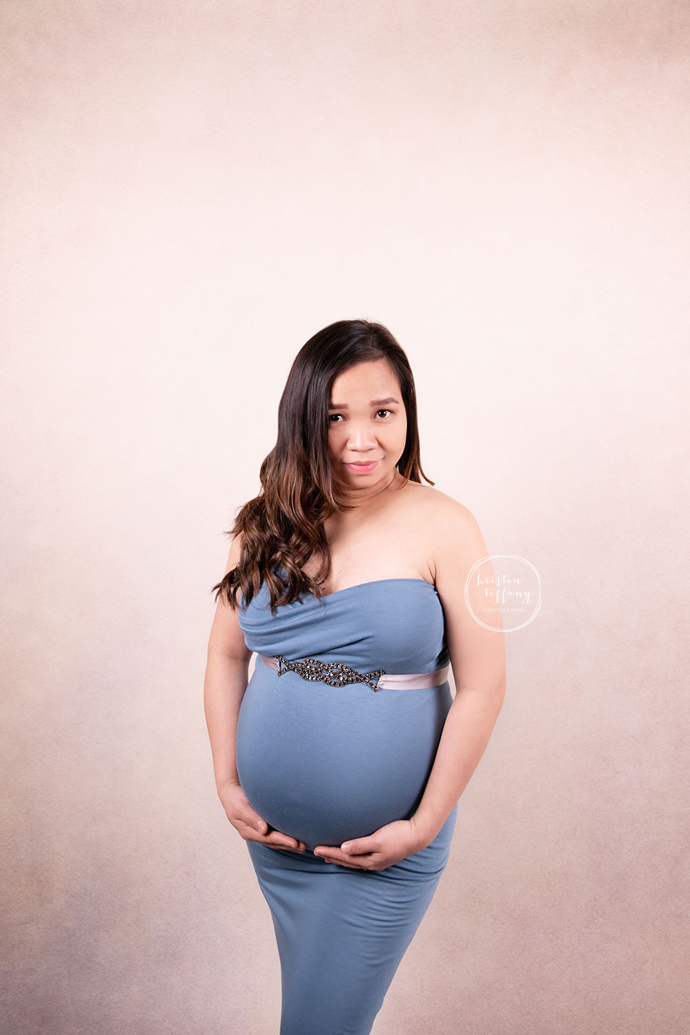a maternity photo of a pregnant woman at a photoshoot
