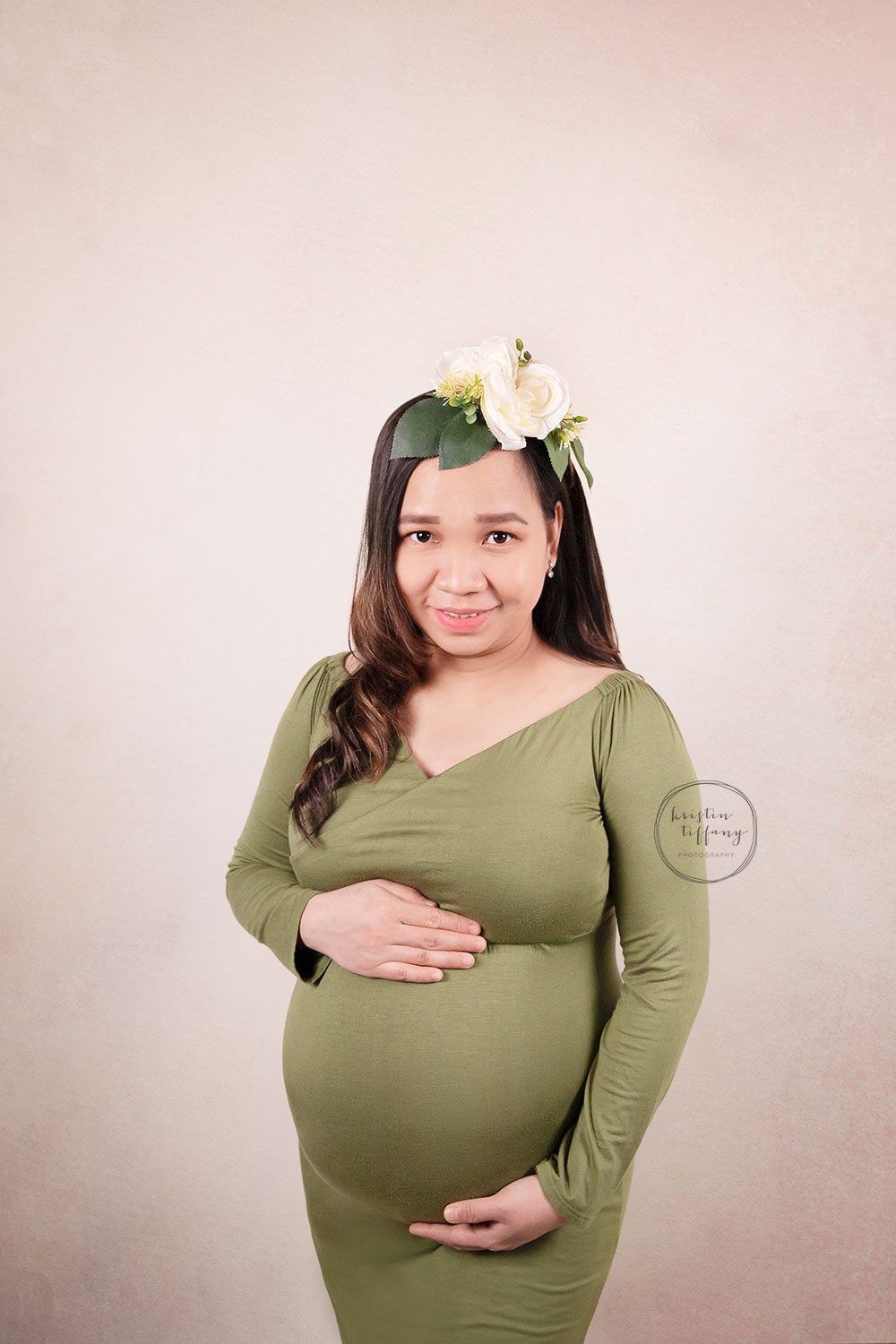 a maternity photo of a pregnant woman at a photoshoot