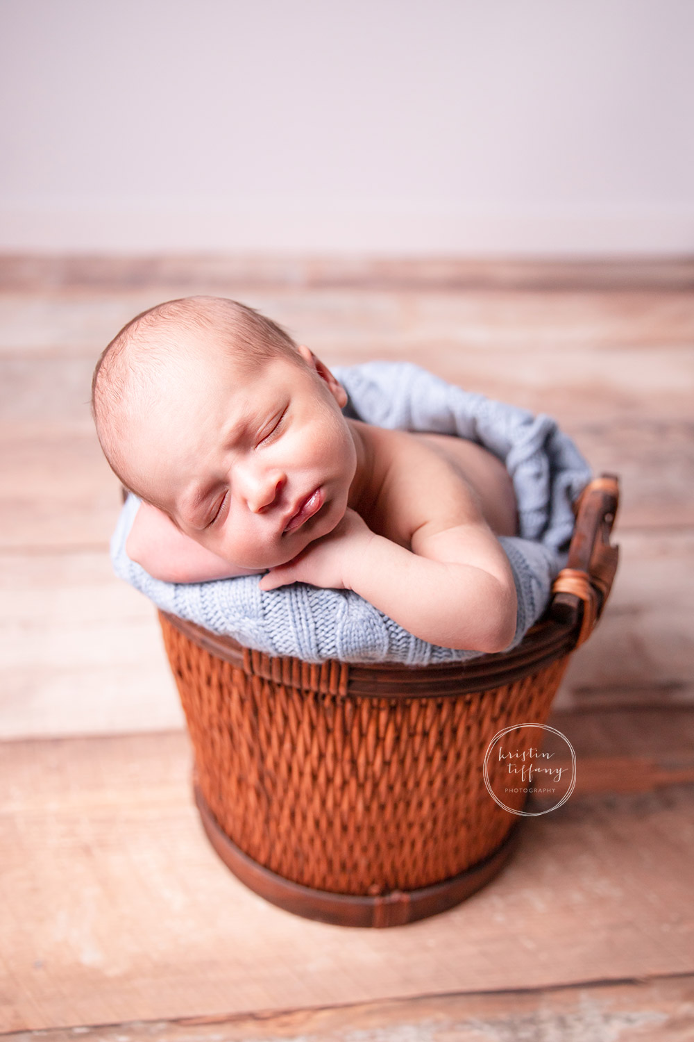 a photo of a newborn baby boy at his newborn photoshoot