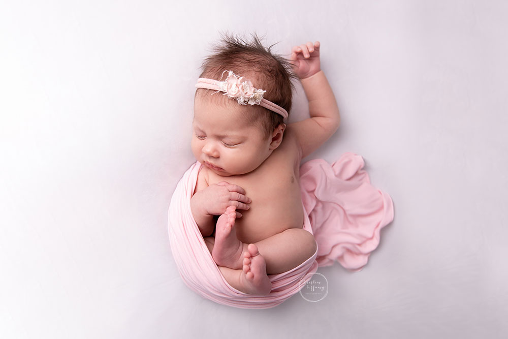 a photo of a baby girl at a baby photo session
