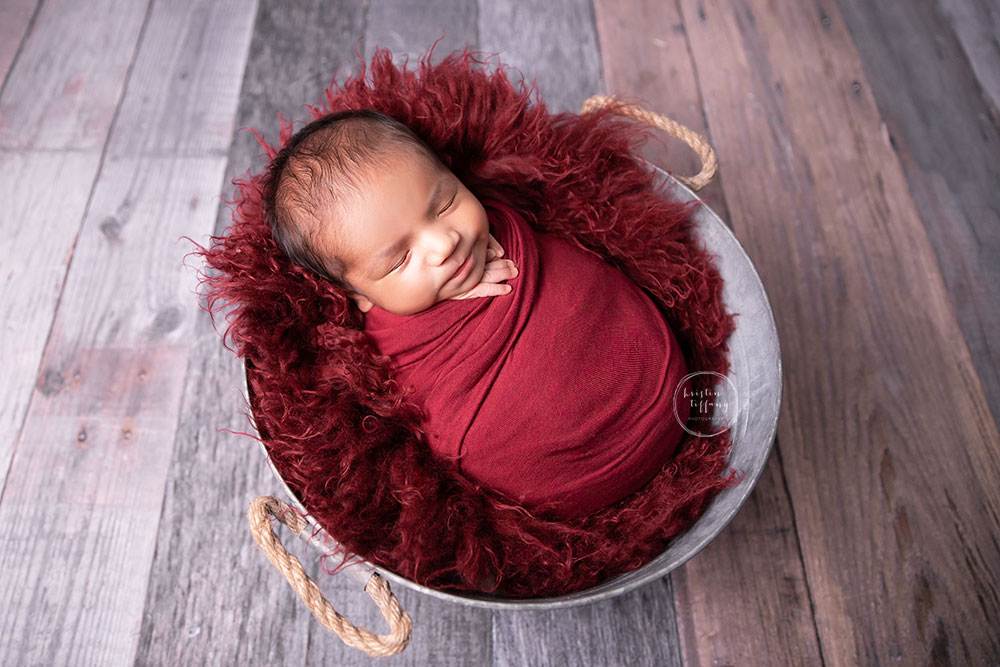 a photo of a baby boy at his newborn photoshoot
