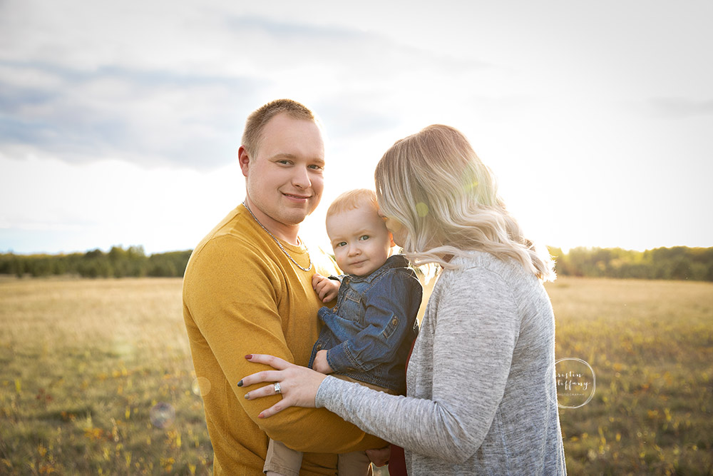 a photo of a family at an outdoor fall photo session