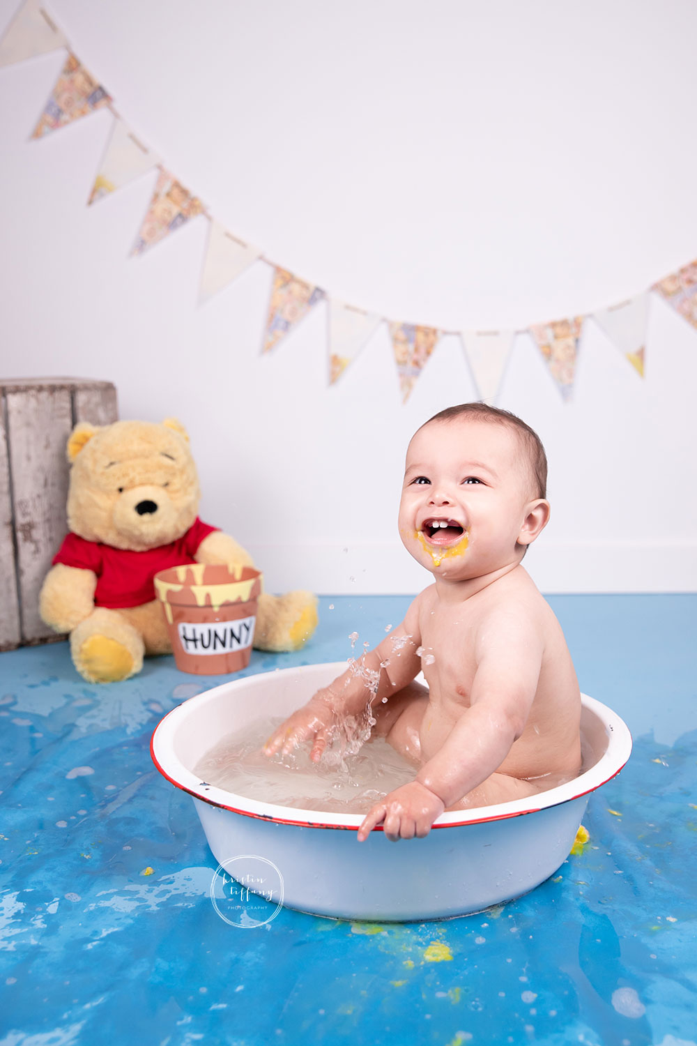 a photo of a baby boy at a cake smash photo session