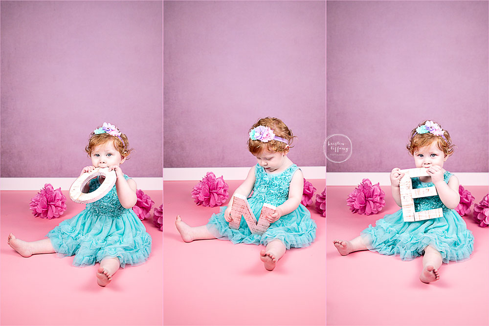 a photo of a baby girl at her unicorn cake smash photoshoot