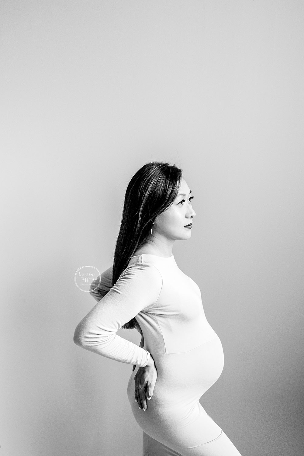 a maternity photo of an expecting mom at her maternity photoshoot