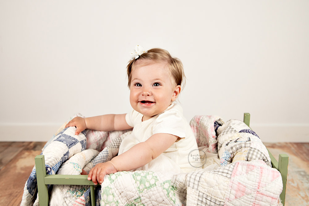 a photo of a baby girl at a sitter session with Kristin Tiffany Photography