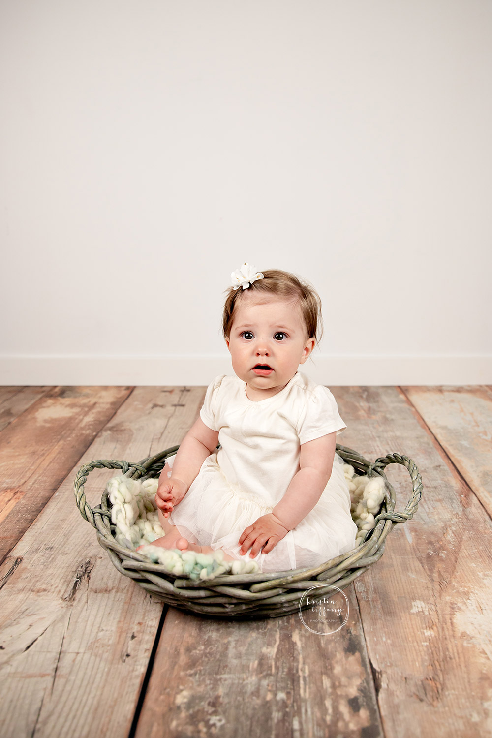 a photo of a baby girl at a sitter session with Kristin Tiffany Photography