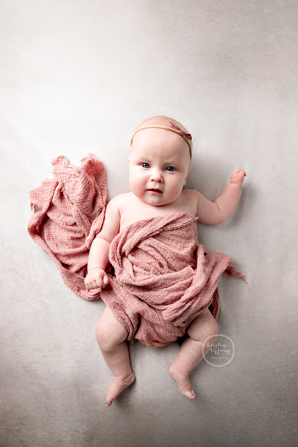 a photo of a baby girl at a photoshoot with Kristin Tiffany Photography