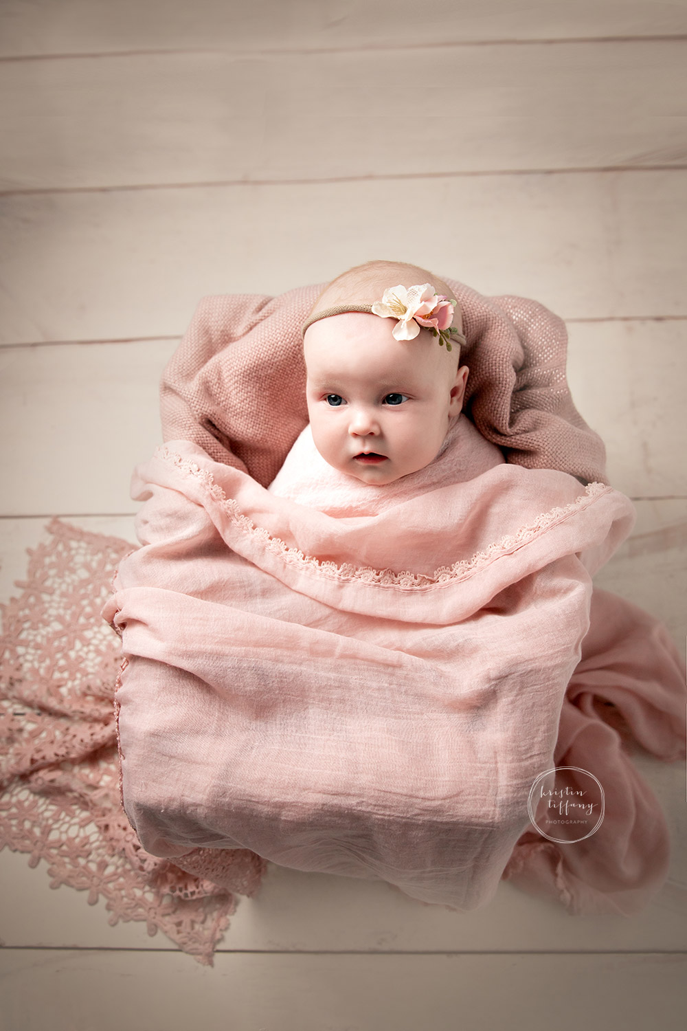 a photo of a baby girl at a photoshoot with Kristin Tiffany Photography